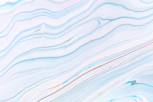 istock Fluid art texture. Abstract backdrop with mixing paint effect. Liquid acrylic artwork with chaotic mixed paints. Can be used for posters or wallpapers. Blue, white and orange overflowing colors. 1221575787