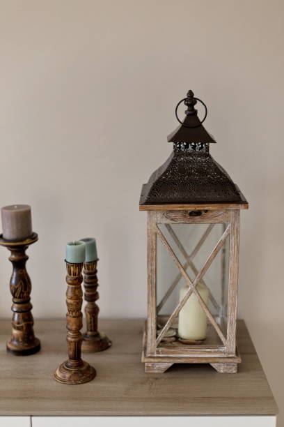 istock Interior accessories. Wooden lantern and candleholders. Negative space. 1221576113