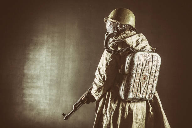 istock Post apocalyptic soldier aiming firearm weapon 1221577343