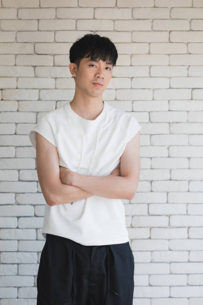 istock Asian model man sitting on floor and knee up. 1221577745