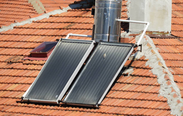 istock hot water with solar energy system, hot water systems on roofs, 1221579207