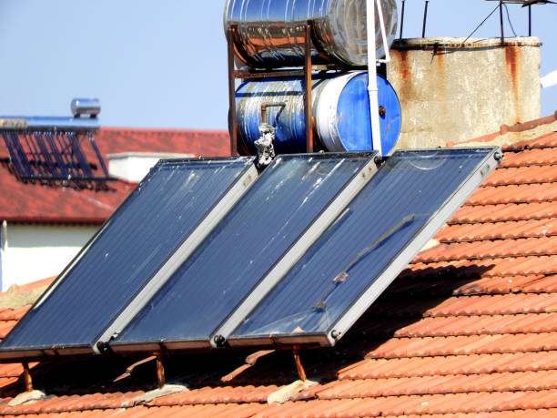 istock hot water with solar energy system, hot water systems on roofs, 1221579210