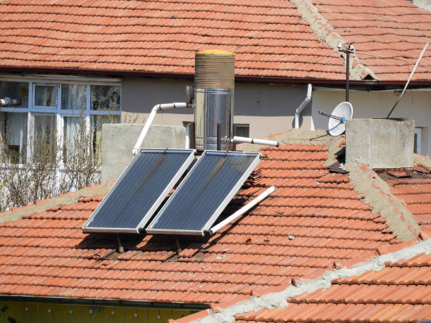 istock hot water with solar energy system, hot water systems on roofs, 1221579270