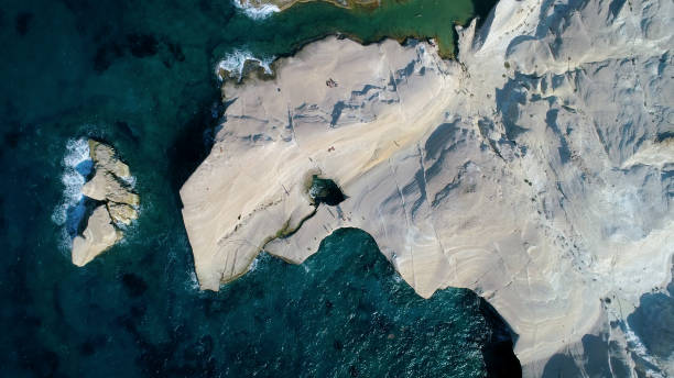 istock Milos Sarakiniko Beach volcanic Landscape from Above 1221579418