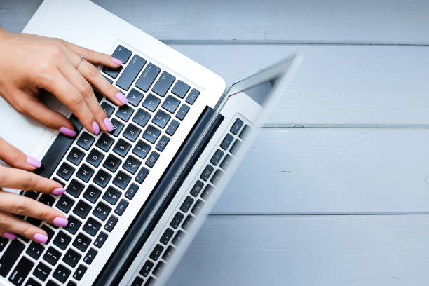 istock Close up female hands typing on laptop keyboard 1221580505