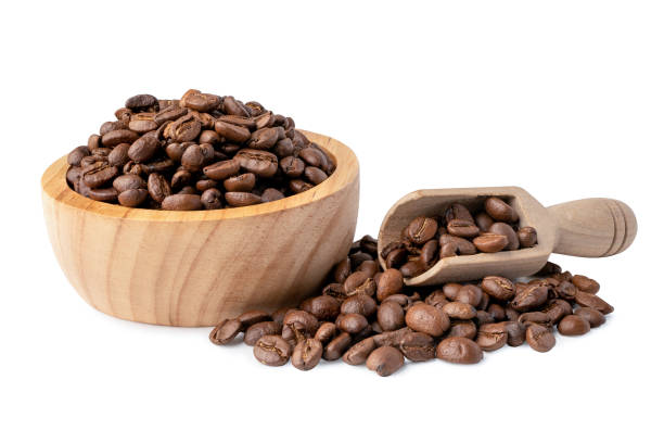 istock Coffee bean medium roasted in wooden bowl isolate on whtie background with clipping path. 1221581118
