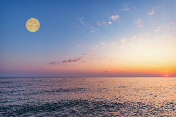 istock Moon above the sea at sunset time. 1221581370