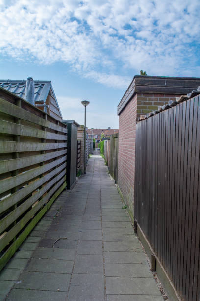 istock fenced alley behind back gardens 1221583680