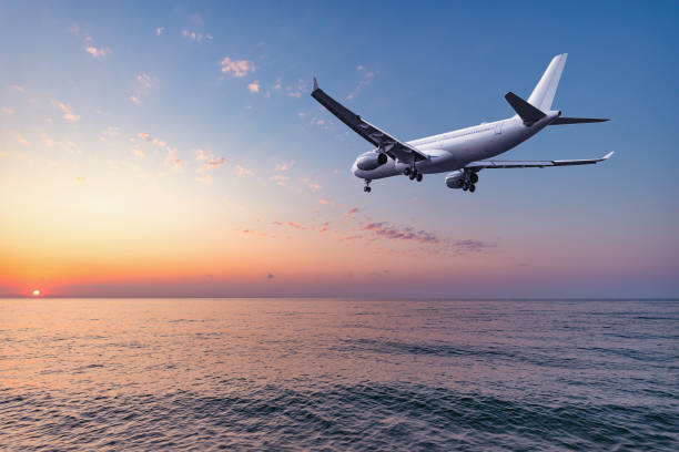 istock Flight of the plane above the ocean before landing. 1221583710