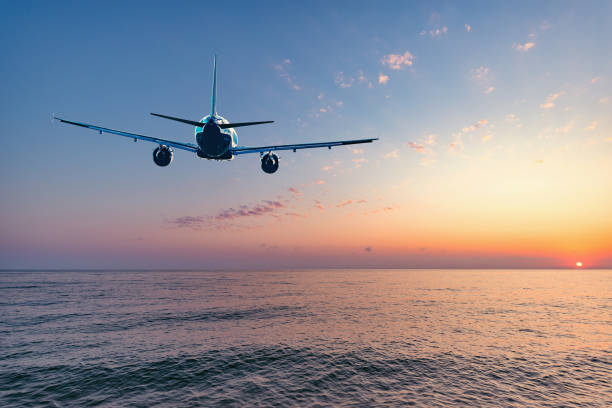istock Flight of the plane above the ocean before landing. 1221583735