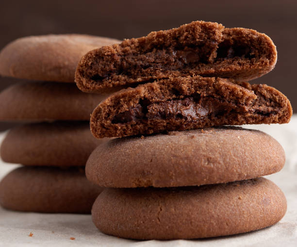 istock round chocolate chip cookies are stacked on a table, delicious d 1221585265