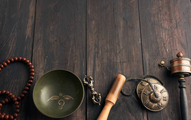 istock Copper singing bowl, prayer beads, prayer drum and other Tibetan 1221585436