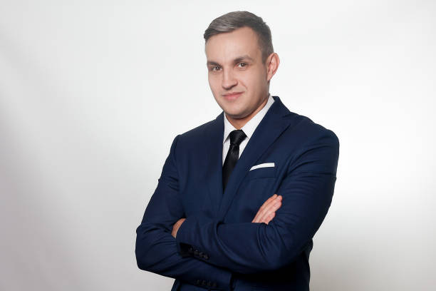 istock Portrait of handsome man in black blue suit 1221590464