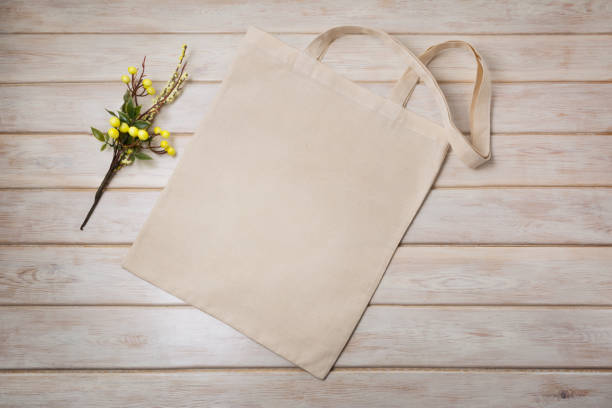 istock Tote bag mockup with yellow branch 1221592736