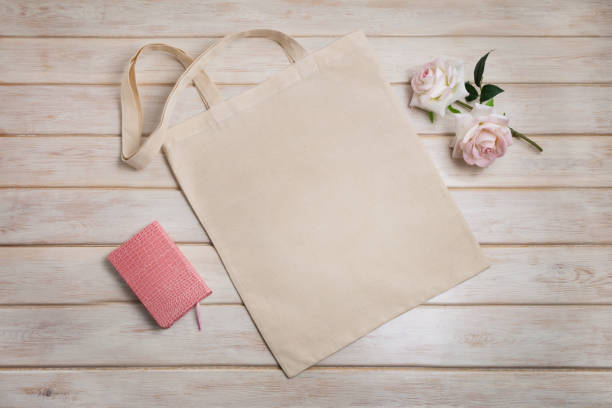 istock Tote bag mockup with roses and notepad 1221592741