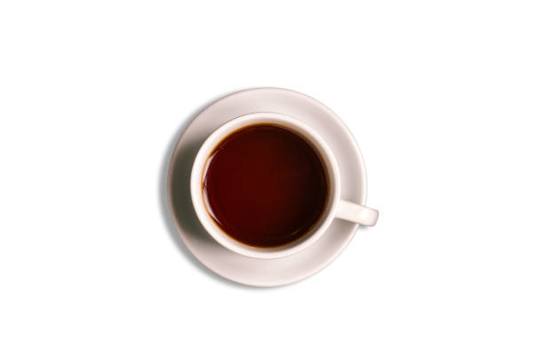 istock White cup and saucer isolated on a white background. Hot tea drink. Black tea. 1221592954