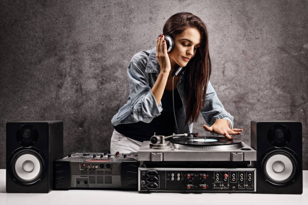 istock Female dj playing music on a turntable 1221593522