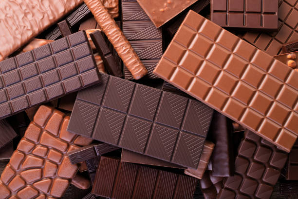istock bars of various chocolate background. sweet dessert, top view 1221594216