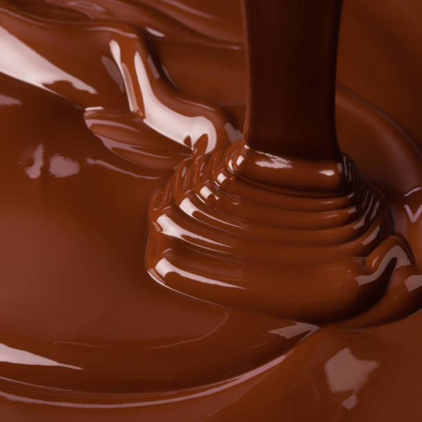 istock melt dark chocolate, sweet background. liquid cocoa texture. 1221594494