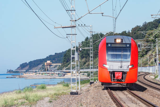 istock Passenger train moves along the sea coast. Sochi. 1221594606