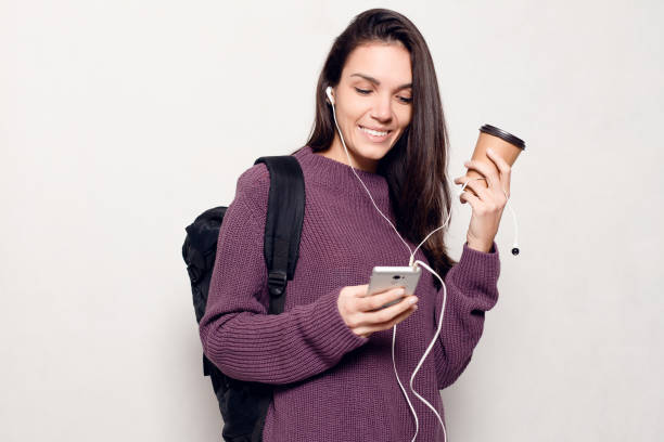 istock Young beautiful woman with smart phone 1221594711