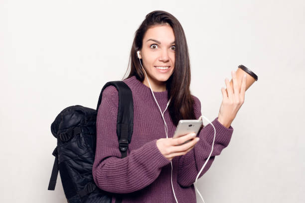 istock Young beautiful woman with smart phone 1221594755