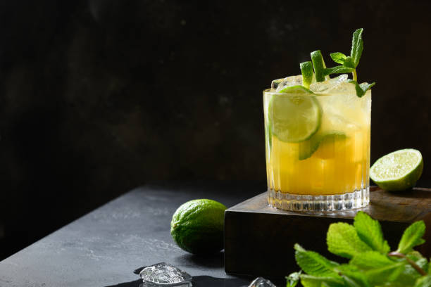 Mai Tai Cocktail. Classic rum tropical cocktail with lime arnish mint on black. Copy space. Mai Tai Cocktail. Classic rum tropical cocktail with lime arnish mint on black. Copy space. Tasty lemonade. mai tai stock pictures, royalty-free photos & images