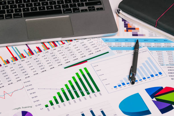 istock Workplace with a computer and analytical charts, diagrams. Accountant's calculations, audit and data analysis. Business, Finance and accounting concepts. 1221595209