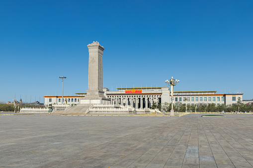 March 27, 2020: Tiananmen Square, Monument to the People ’s Heroes and National Museum, China, Beijing, During the COVID-19 Virus epidemic, The usually crowded Tiananmen Square is empty.
