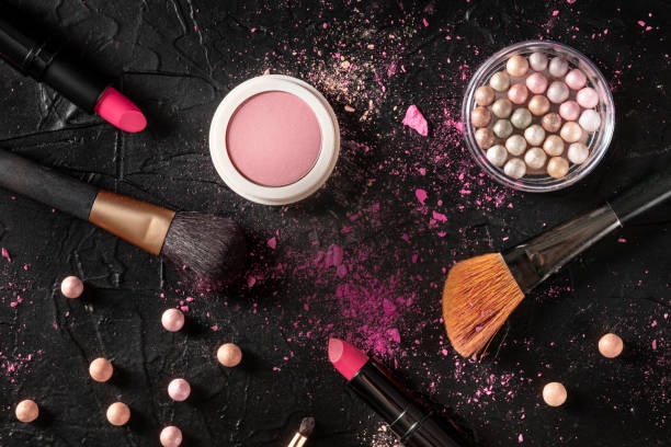 istock Professional make-up on a black background. Brushes, lipstick and other products, a flatlay with copyspace 1221596513