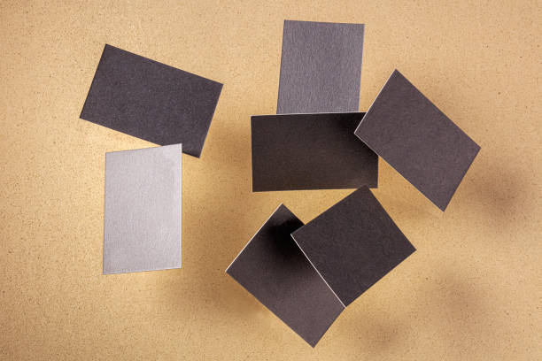 istock Thick business cards, flying on a brown background, a mockup for design presentation 1221596562