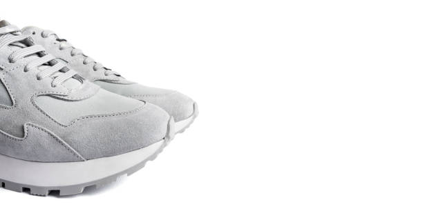 istock Gray sneakers isolated on white background. 1221597667