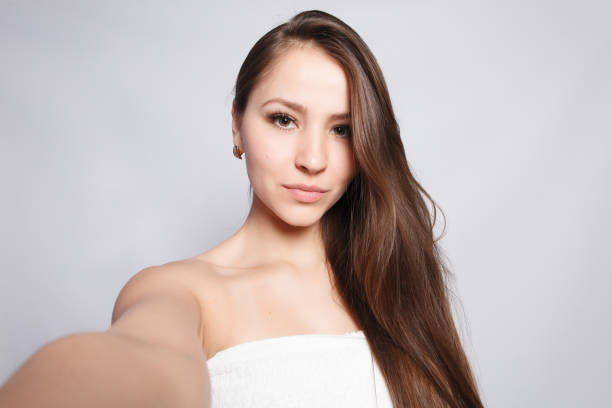 istock Spa Woman. Beautiful Girl After Bath Touching Her Face. 1221600464