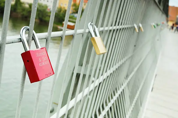 Romantic way in which Regensburg citizens celebrate their moment of starting live together. Love locks connected too bridge over Danube, Regensburg, Germany!