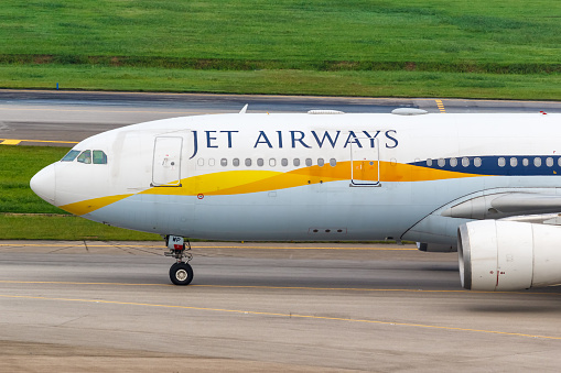Changi, Singapore – January 29, 2018: Jet Airways Airbus A330-200 airplane at Changi airport (SIN) in Singapore. Airbus is a European aircraft manufacturer based in Toulouse, France.