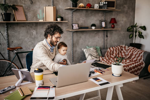 istock Single Father And Baby in home office 1221603941