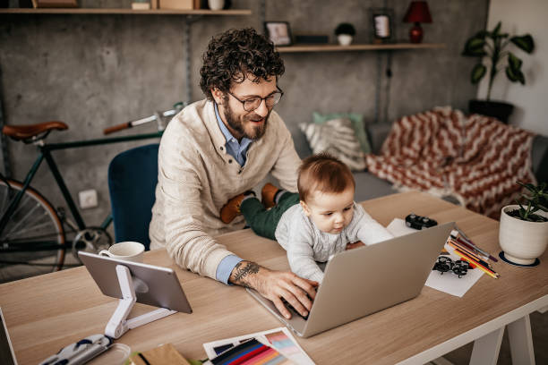 istock Single Father And Baby in home office 1221604893