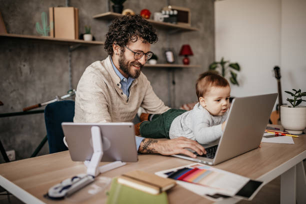 istock Single Father And Baby in home office 1221605335
