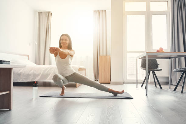 istock Joyful longhaired female person stretching her legs 1221605654