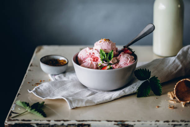 Homemade delicious strawberry ice-cream Close-up of strawberry ice cream bowl. Homemade delicious strawberry ice-cream on table. Pint of Ice Cream stock pictures, royalty-free photos & images