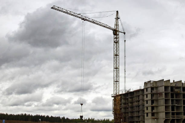 istock Industrial construction cranes the construction of an building 1221607575