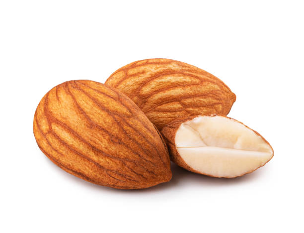 istock Closeup of almonds, isolated on white background 1221608600