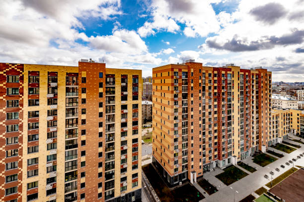 istock Modern multi-storey building in a new district of Moscow on a spring day 1221610609