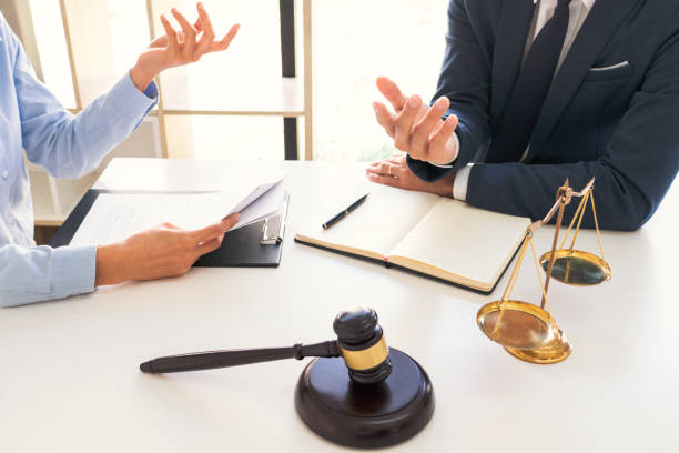 istock Lawyer And Client Sitting At Table 1221611156