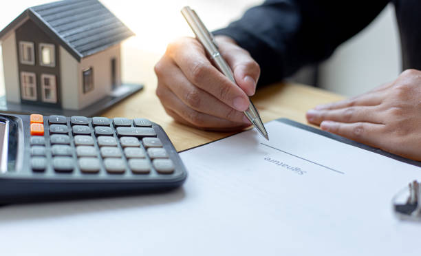 istock Cropped Image Of Person Signing On Form 1221611816