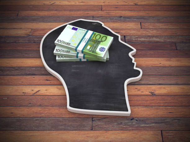 istock Human Head Shape with Euro Bill Package on Wood Floor - 3D Rendering 1221612615
