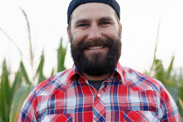 istock Farmer, close up of face in corn field 1221613804