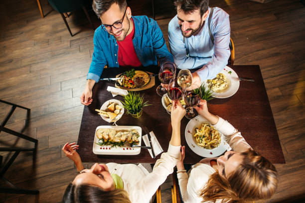 istock Young people eating lunch at restaurant 1221613937