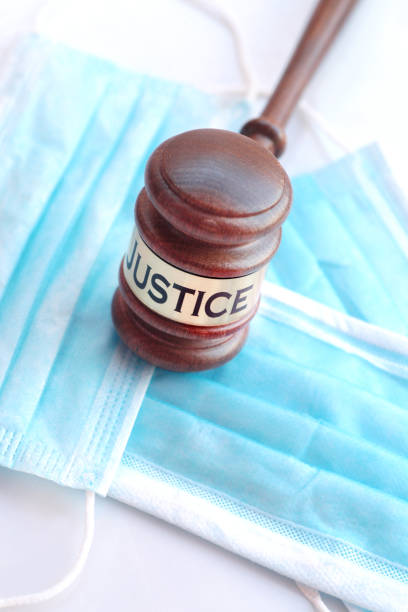 istock Covid face masks and gavel 1221613940