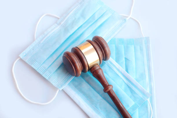 istock Covid face masks and gavel 1221613941
